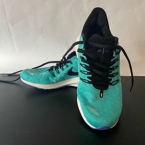 Nike sneakers. Worn once. Size 9. Color is teal & black.